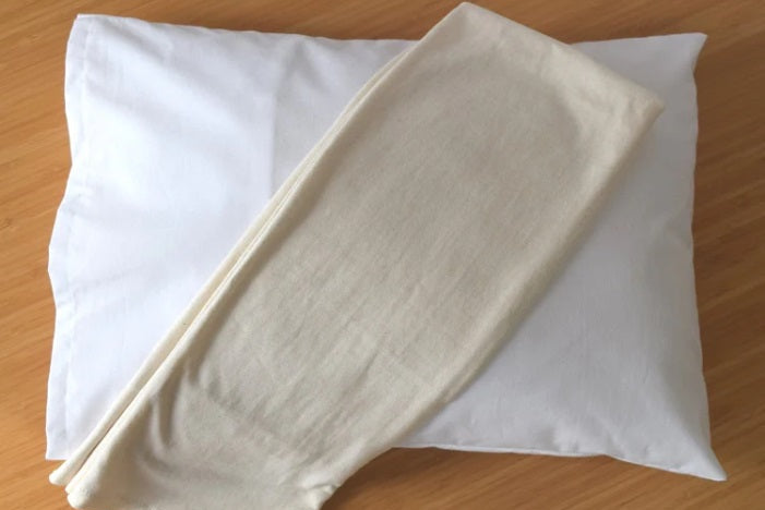 Child Size 16x22 White and natural organic cotton jersey knit flap style pillowcases from A Little Pillow Company 100% grown and made in the USA