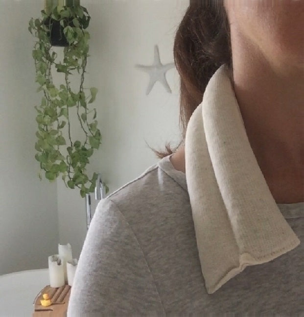 Therapy Spa Neck Wrap draped around a woman's neck and shoulders by A Little Pillow Company
