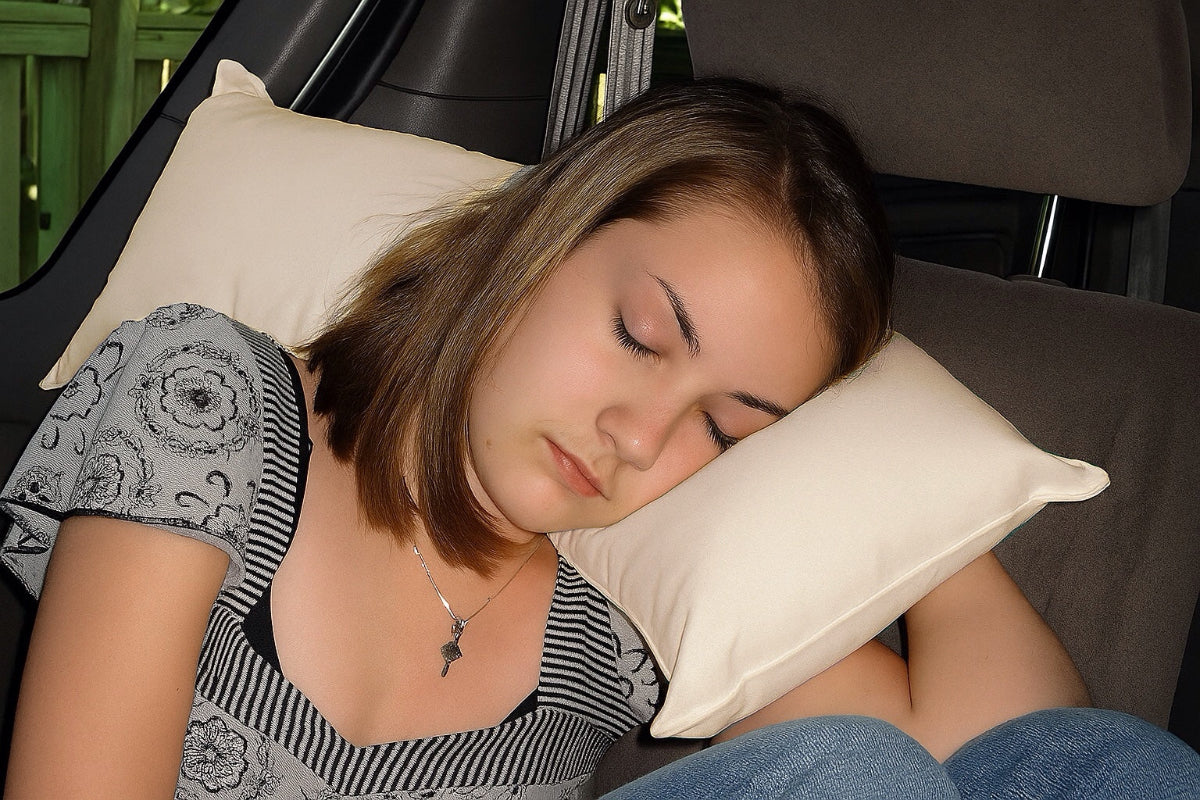 Girl using the All-Support Pillow with natural organic cotton pillowcase from A Little Pillow Company. 100% USA Made from all USA sourced organic and sustainable materials.
